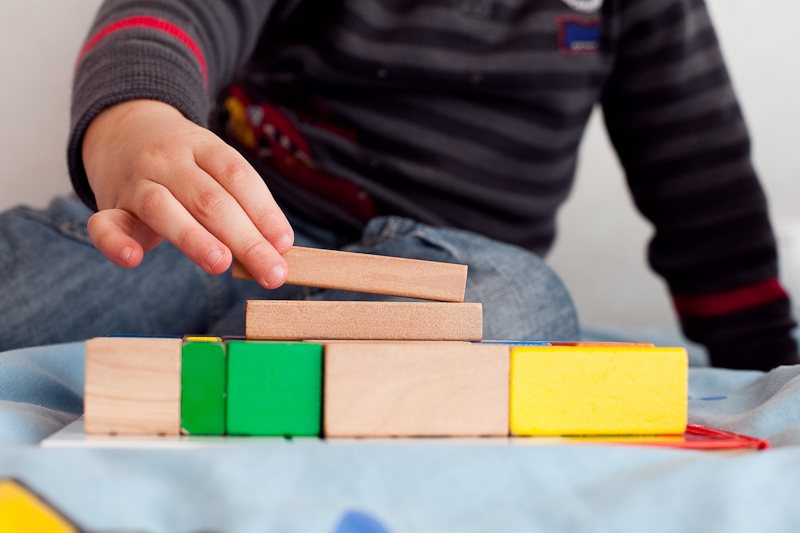 a child playing with building blocks